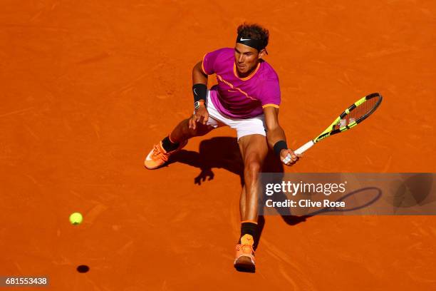 Rafael Nadal of Spain in action during his match against Fabio Fognini of Italy on day five of the Mutua Madrid Open tennis at La Caja Magica on May...