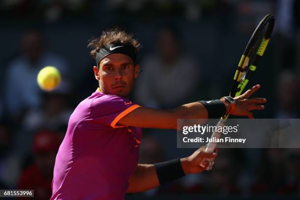 Rafael Nadal of Spain in action against Fabio Fognini of Italy during day five of the Mutua Madrid Open tennis at La Caja Magica on May 10, 2017 in...