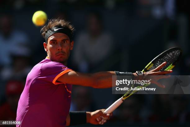Rafael Nadal of Spain in action against Fabio Fognini of Italy during day five of the Mutua Madrid Open tennis at La Caja Magica on May 10, 2017 in...