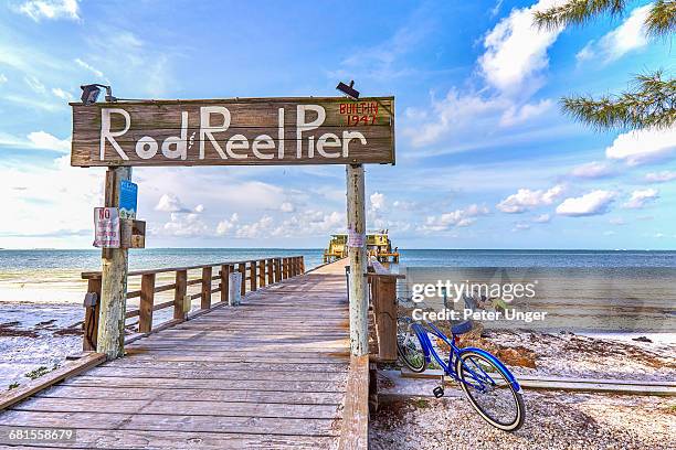 rod reel pier, anna maria island, florida - wooden sign post stock pictures, royalty-free photos & images