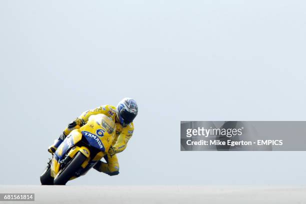Makoto Tamada rides over the hill