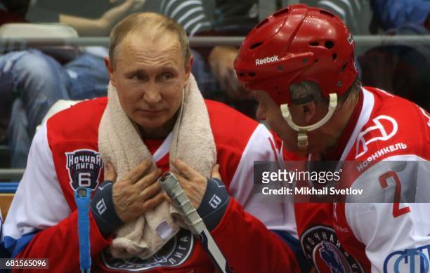 Russian President Vladimir Putin and former NHL player Slava Fetisov attend a gala match of the Night Hockey League teams at the Bolshoy ice arena at...