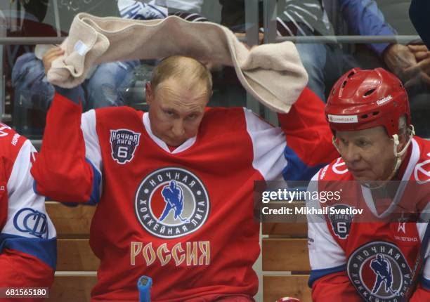 Russian President Vladimir Putin and former NHL player Slava Fetisov attend a gala match of the Night Hockey League teams at the Bolshoy ice arena at...