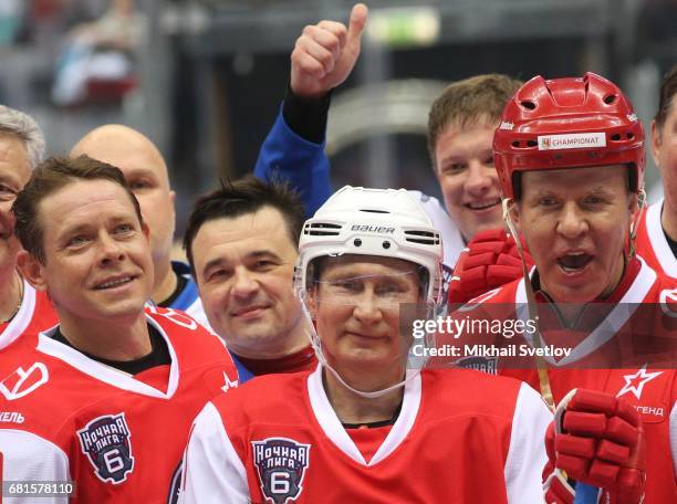 Russian President Vladimir Putin , former NHL players Slava Fetisov and Pavel Bure attend a gala match of the Night Hockey League teams at the...
