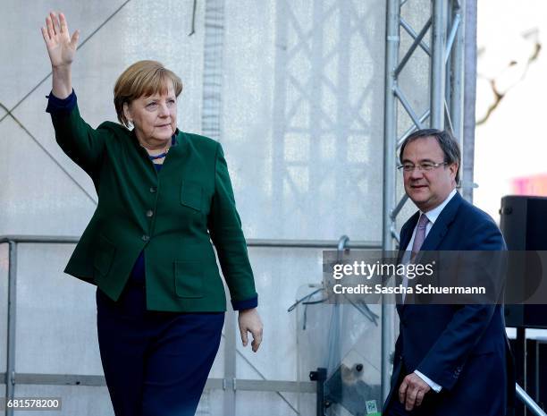 German Chancellor and leader of the German Christian Democrats Angela Merkel and lead CDU candidate Armin Lachet greets supporters while campaigning...