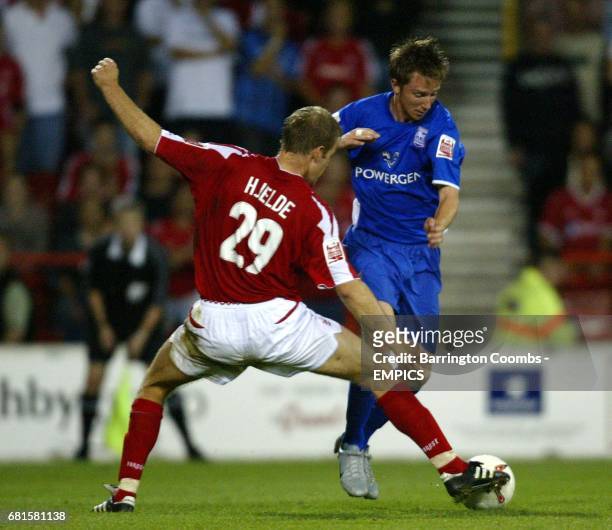 Nottingham Forest's Jon Olav Hjelde and Ipswich Town's Dean Bowditch battle for the ball