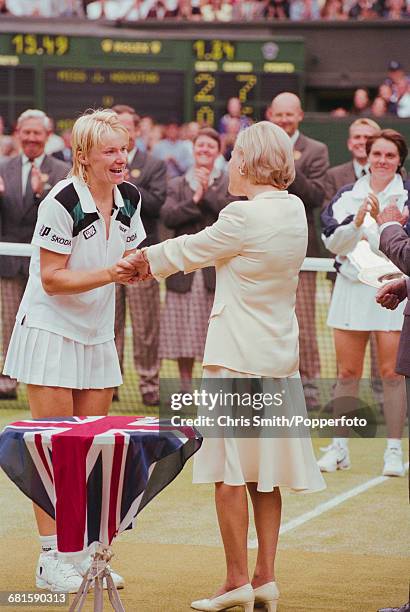 Czech tennis player Jana Novotna is presented with the Venus Rosewater Dish trophy by Katharine, Duchess of Kent after winning the final of the...