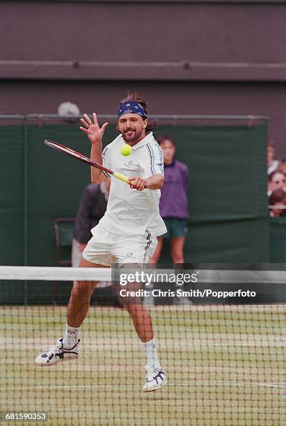 Croatian tennis player Goran Ivanisevic pictured in action to win against Dutch tennis player Richard Krajicek, 6-3, 6-4, 5-7, 6-7, 15-13 in the...