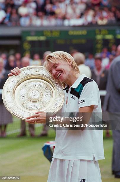 Czech tennis player Jana Novotna embraces the Venus Rosewater Dish trophy after winning the final of the Women's Singles tournament against Nathalie...