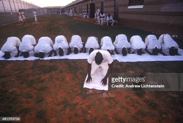 Prisoners leave for work and return to the Limestone Correctional Facility in chains on July 15, 1995 outside of Huntsville, Alabama. The state of...