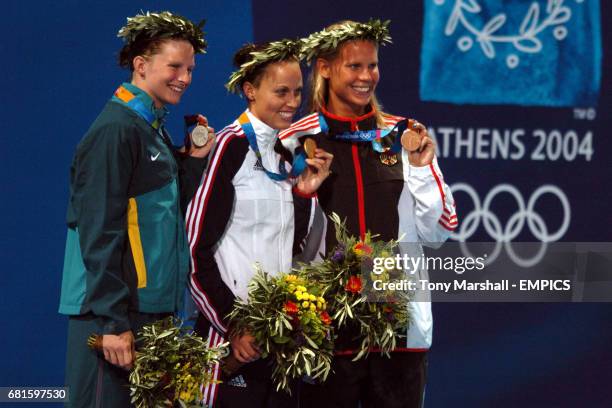 Australia's Leisel Jones , USA's Amanda Beard and Germany's Anne Poleska celebrate with their medals