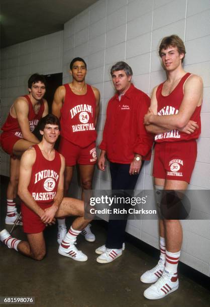 Portrait of Indiana head coach Bobby Knight posing with players Steve Alford, Marty Simmons, Daryl Thomas and Todd Meier at Assembly Hall....