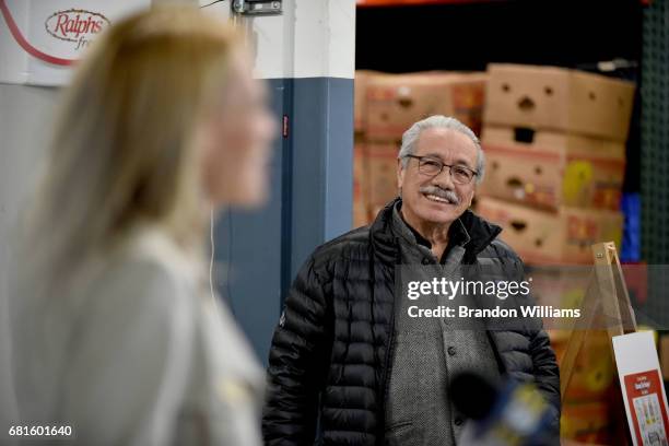 Actor / philanthropist Edward James Olmos watches as actor Jerry Ryan speaks to attendees at the food drive for "Stamp Out Hunger" at MEND - Meet...