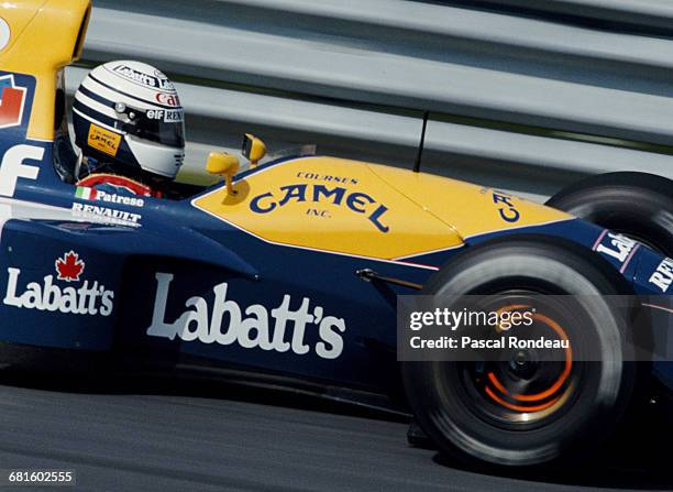 Riccardo Patrese of Italy lights up the disc brakes driving the Canon Williams Renault Williams FW14B Renault V10 during the Canadian Grand Prix on...