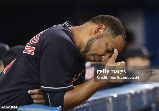 Edwin Encarnacion of the Cleveland Indians looks on from the dugout during MLB game action against the Toronto Blue Jays at Rogers Centre on May 9,...