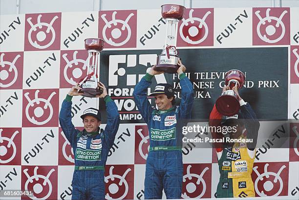 Nelson Piquet of Brazil, driver of the Benetton Formula Benetton B189B Ford V8 celebrates with second placed team mate Roberto Moreno and third...