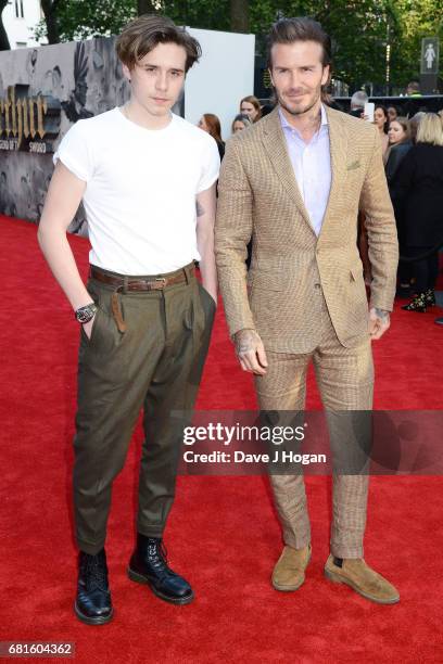 Brooklyn Beckham and David Beckham attend the European premiere of "King Arthur: Legend of the Sword" at Cineworld Empire on May 10, 2017 in London,...