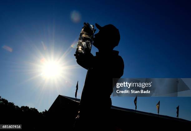 Golfer is seen kissing THE PLAYERS Championship trophy is seen during previews prior to the start of THE PLAYERS Championship on THE PLAYERS Stadium...