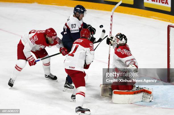 May 10, 2017 -- Marcel Hascak of Slovakia attacks as Denmark's goalkeeper Sebastian Dahm saves during the 2017 IIHF Ice Hockey World Championship...