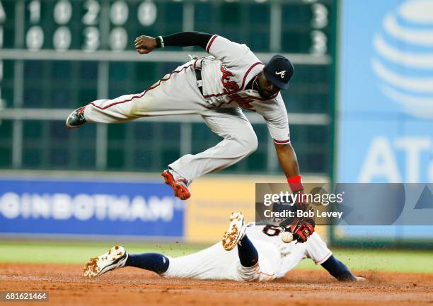 Houston Astros center fielder Jake Marisnick steals second base in the third inning as Atlanta Braves second baseman Brandon Phillips can't handle...