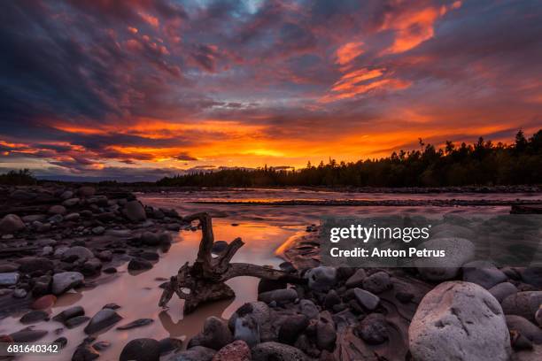 colorful sunset over the mountain river - kronotsky state biosphere reserve stockfoto's en -beelden