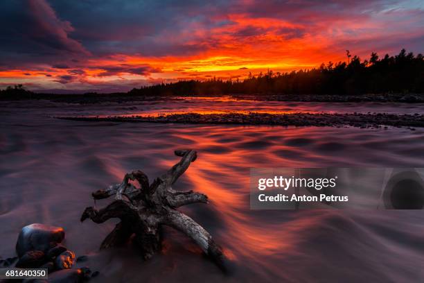 colorful sunset over the mountain river - kronotsky state biosphere reserve stockfoto's en -beelden