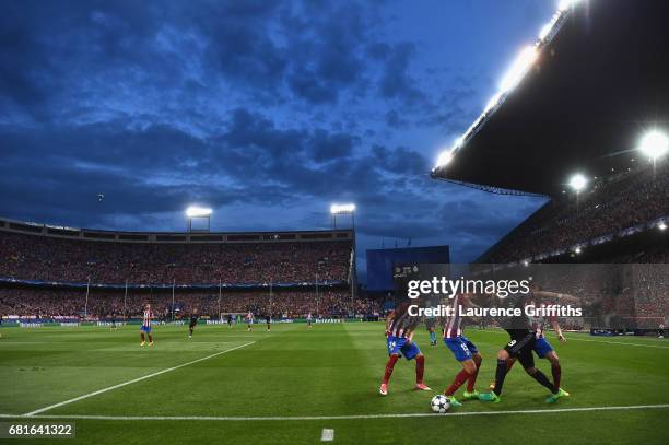 General view as Karim Benzema of Real Madrid takes on Stefan Savic of Atletico Madrid during the UEFA Champions League Semi Final second leg match...