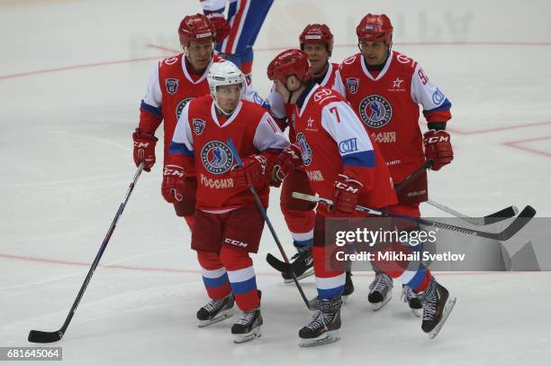Russian President Vladimir Putin plays ice hockey with retired NHL players: Slava Fetisov , Pavel Bure and Alexey Kasatonov during the gala match of...