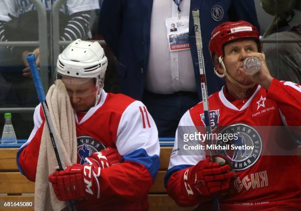 Russian President Vladimir Putin and retired NHL player Slava Fetisov attend a gala match of the Night Hockey League teams at the Bolshoy ice arena...