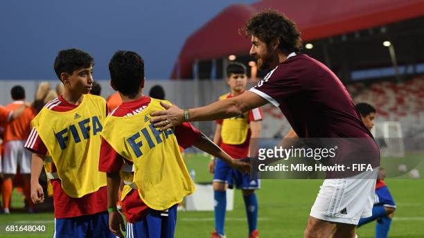 Legend Pablo Aimar takes part during a grassroots training sesson with local children at the Bahrain National Stadium ahead of the 67th FIFA Congress...