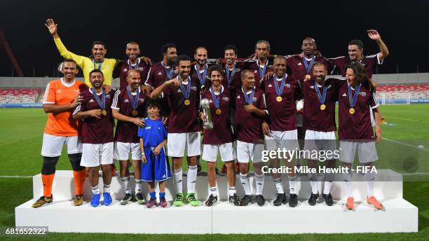 The Bahrain FA team, with FIFA Legends Pablo Aimar and Alexei Smertin , celebrates victory in the FIFA Football Tournament at the Bahrain National...