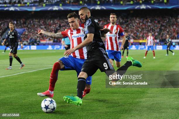Karim Benzema, #9 of Real Madrid and Gabi, #14 of Atletico de Madrid during the UEFA Champions League quarter final first leg match between Club...