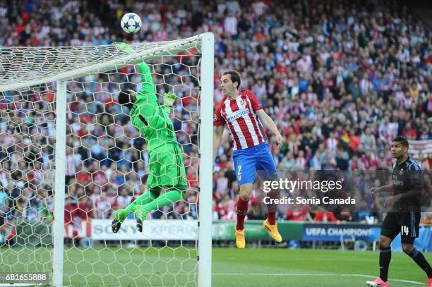 Diego Godin, #2 of Atletico de Madrid and Keylor Navas, #1 of Real Madrid during the UEFA Champions League quarter final first leg match between Club...