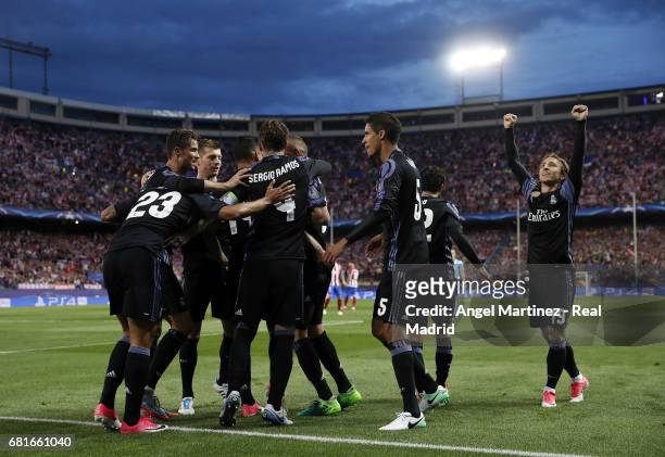 Real Madrid players celebrate their team's first goal during the UEFA Champions League Semi Final second leg match between Club Atletico de Madrid...