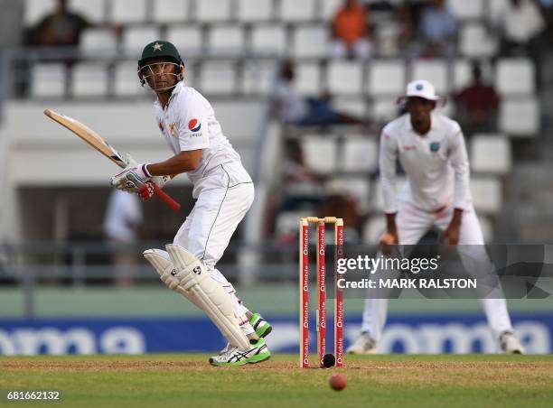 Batsman Younis Khan of Pakistan who is playing in his final test match, plays a hook shot off the bowling of Jason Holder of the West Indies during...