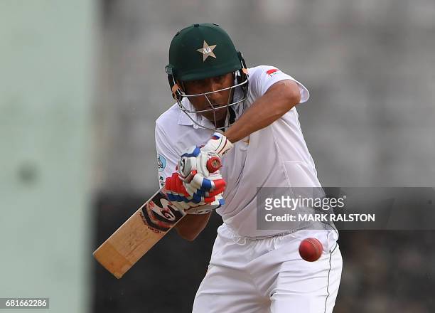 Batsman Younis Khan of Pakistan who is playing in his final test match, plays a shot off the bowling of Devendra Bishoo of the West Indies during the...