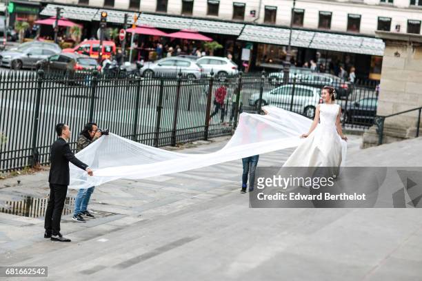 Couple takes wedding pictures at the Madeleine church, on September 17, 2016 in Paris, France. All over the year, couples come to take pictures in...