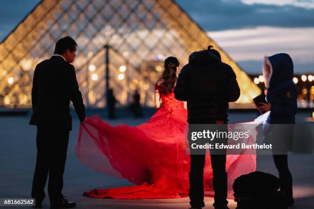 Couple takes wedding pictures at the Louvre in front of the Pyramid, on November 06, 2016 in Paris, France. All over the year, couples come to take...