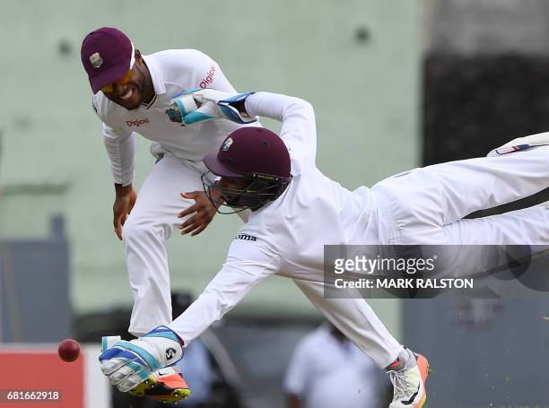 West Indies wicketkeeper Shai Hope dives but misses the catch from batsman Babar Azam of Pakistan during the first day of play, of the 3rd and final...