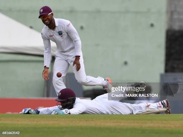 West Indies wicketkeeper Shai Hope dives but misses the catch from batsman Babar Azam of Pakistan during the first day of play, of the 3rd and final...