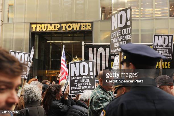 Protesters gather outside of Trump Tower a day after FBI Director James Comey was fired by President Donald Trump on May 10, 2017 in New York City....