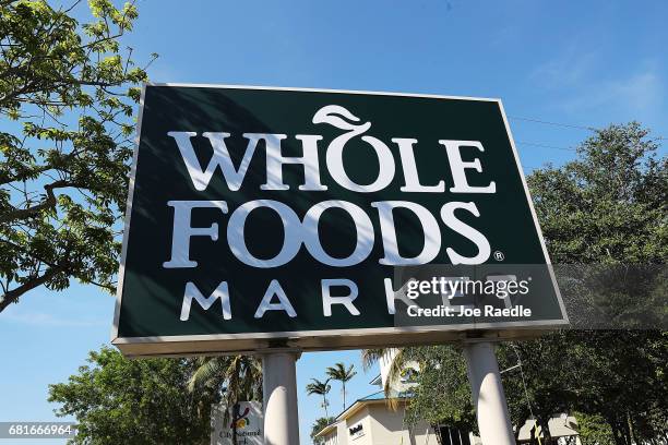 Whole Foods Market sign is seen outside the store as the company appointed five new directors to its board and replaced its chairman on May 10, 2017...