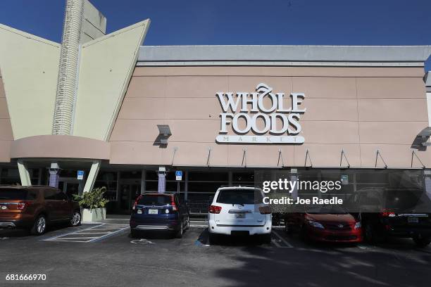 Whole Foods Market sign is seen outside the store as the company appointed five new directors to its board and replaced its chairman on May 10, 2017...