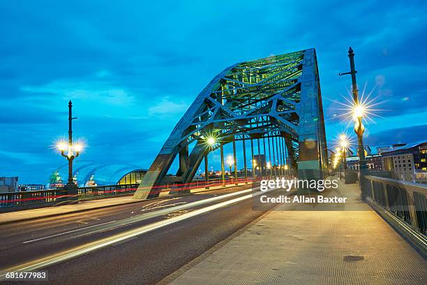 the arch of the tyne bridge at dusk - arch bridge stock pictures, royalty-free photos & images