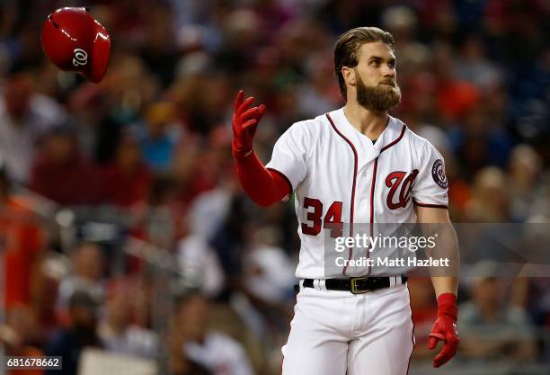 Bryce Harper of the Washington Nationals reacts after striking out for the third out of the third inning against the Baltimore Orioles at Nationals...