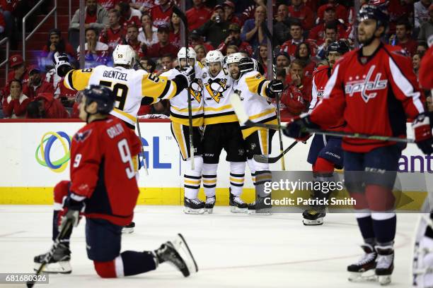 Bryan Rust of the Pittsburgh Penguins celebrates scoring a second period goal with teammates Sidney Crosby, Ian Cole and Jake Guentzel against the...