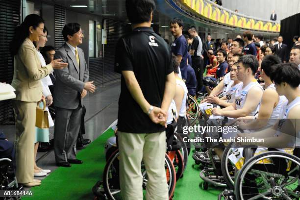 Crown Princess Masako, Princess Aiko and Crown Prince Naruhito talk with players at a wheelchair basketball match at the Tokyo Metropolitan Gymnasium...