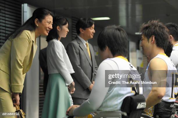 Crown Princess Masako, Princess Aiko and Crown Prince Naruhito talk with players at a wheelchair basketball match at the Tokyo Metropolitan Gymnasium...