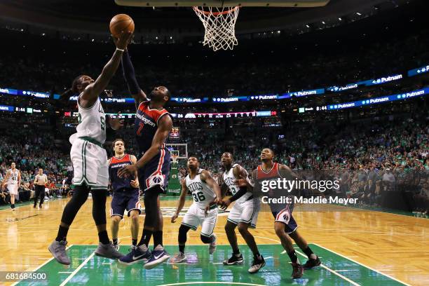 Jae Crowder of the Boston Celtics takes a shot against John Wall of the Washington Wizards during the first half of Game Five of the Eastern...