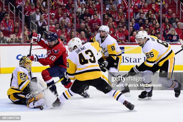 Marc-Andre Fleury of the Pittsburgh Penguins makes a save against Lars Eller of the Washington Capitals in the second period in Game Seven of the...